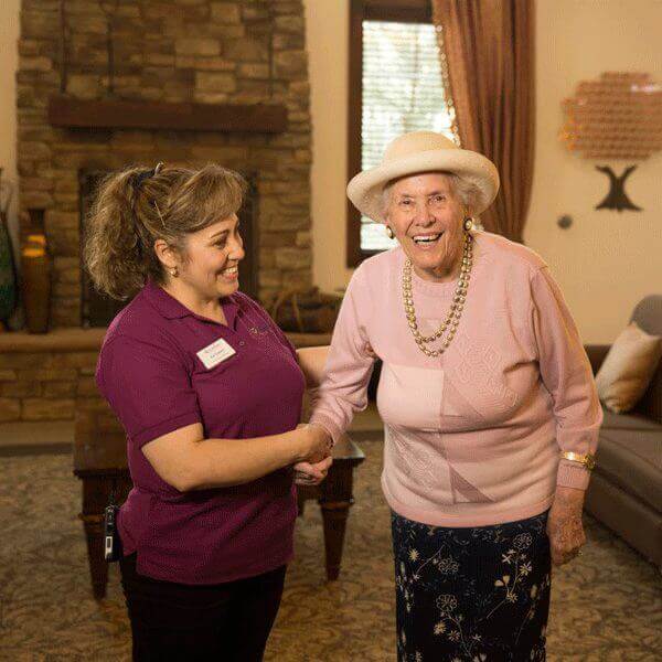 Happy resident and staff at Elk Grove Community Happy resident and staff at Elk Grove Community